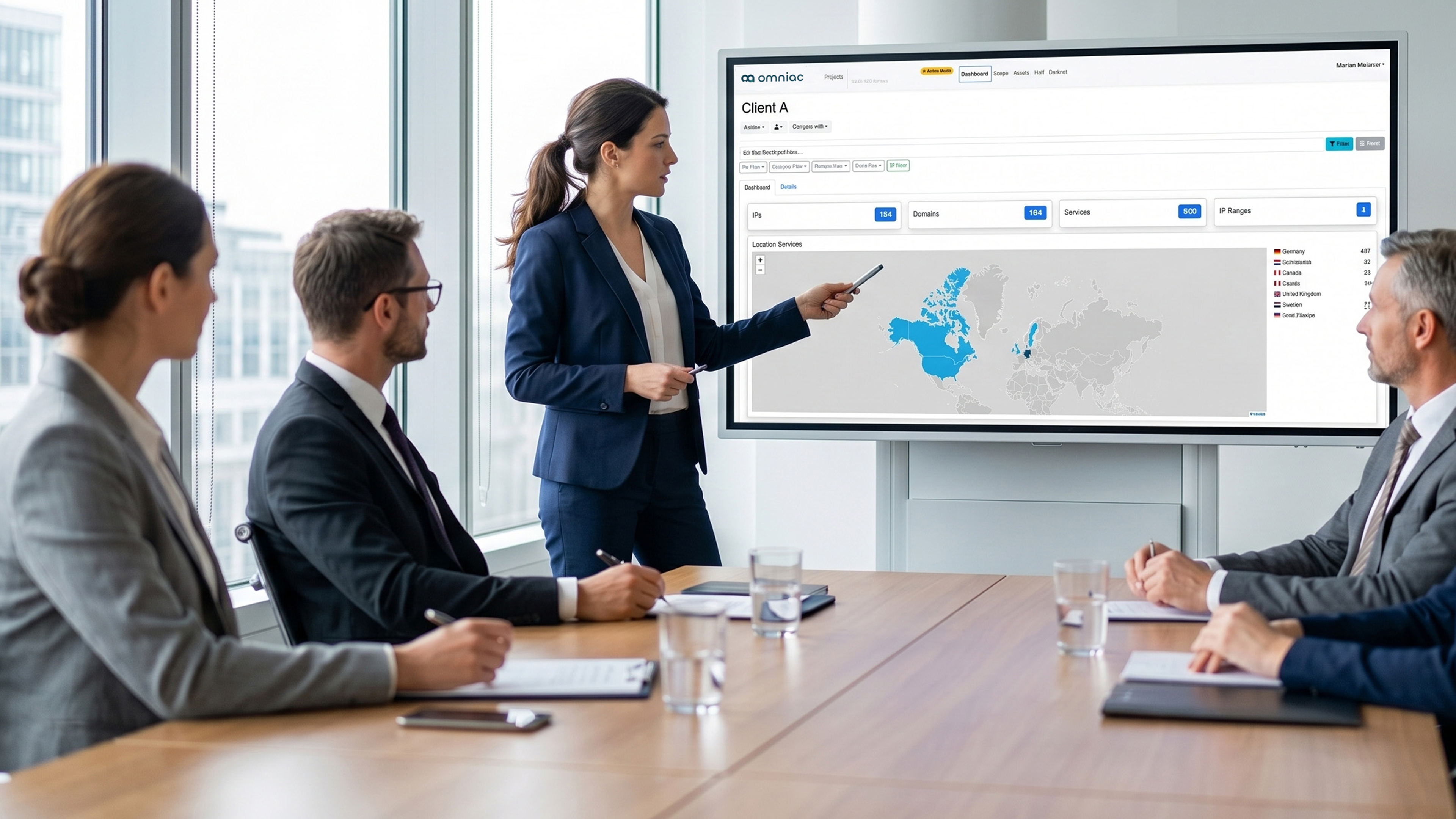 A woman showing the omniac Business Platform Dashboard.